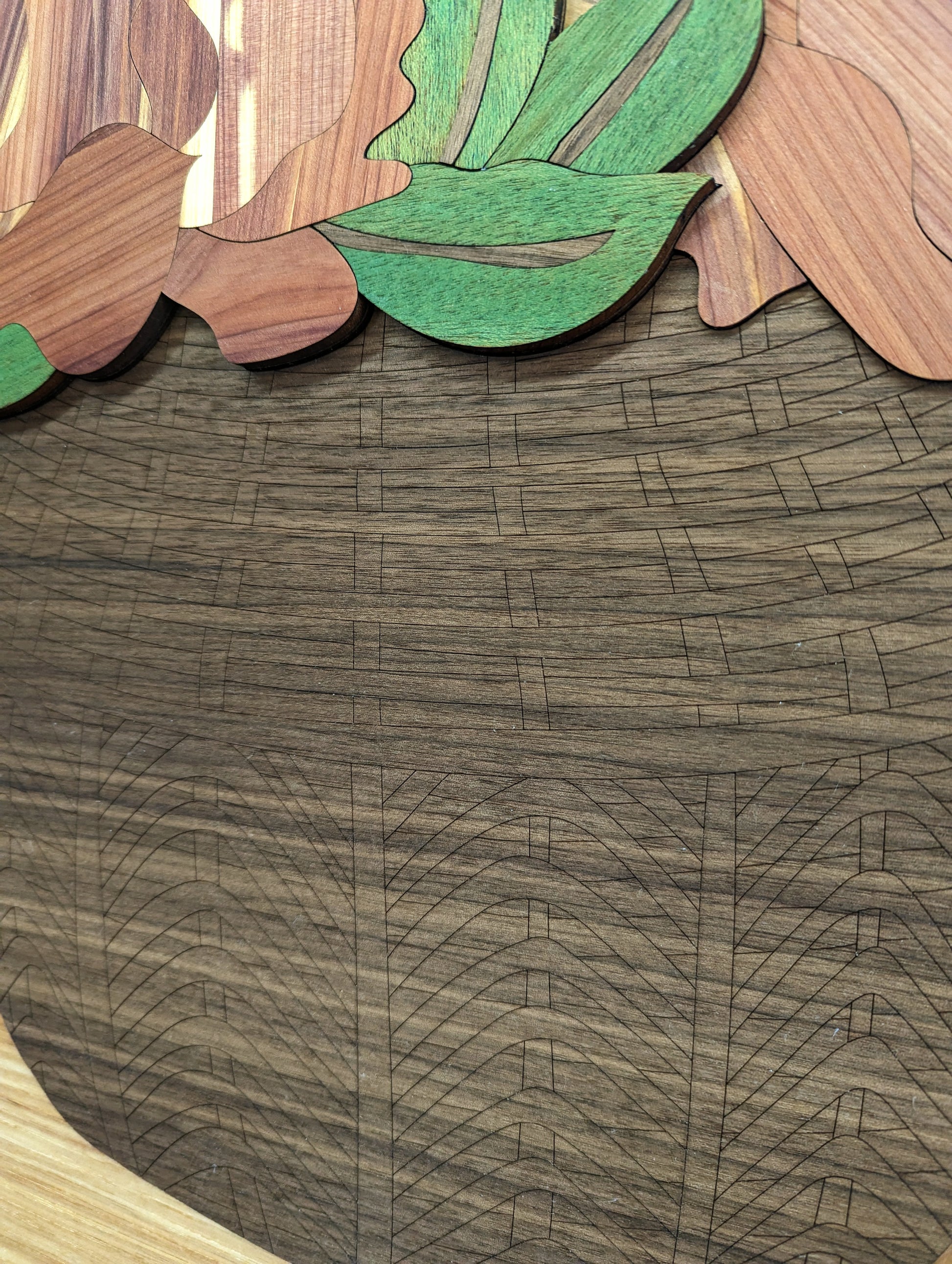 Closeup view of detail on the basket in the Laser Cut Wood Inlay wall art piece