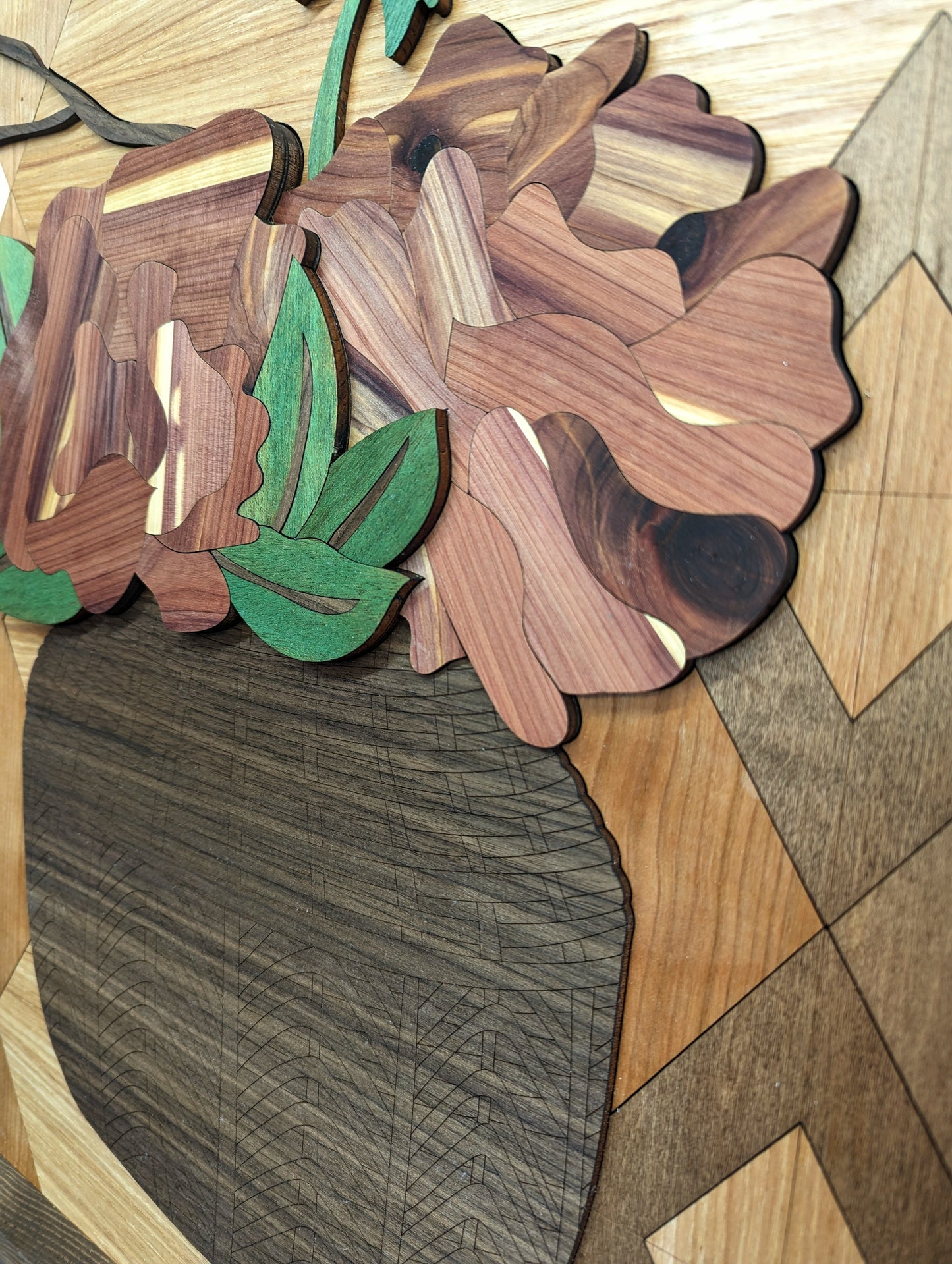 Closeup view of layers and detail on the basket in the Laser Cut Wood Inlay wall art piece