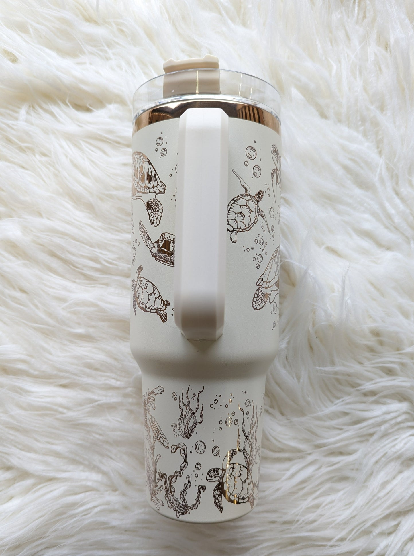 Photo collage of 40 oz cream/copper insulated tumbler with sea turtle oceanic design engraved