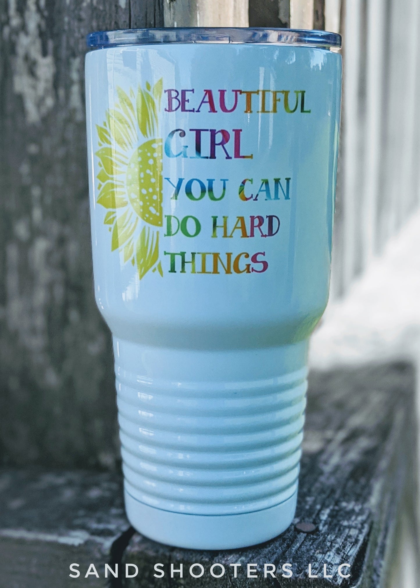 Photo of a white 30 oz tumbler with color printed image of a sunflower and text that reads "Beautiful girl, you can do hard things."