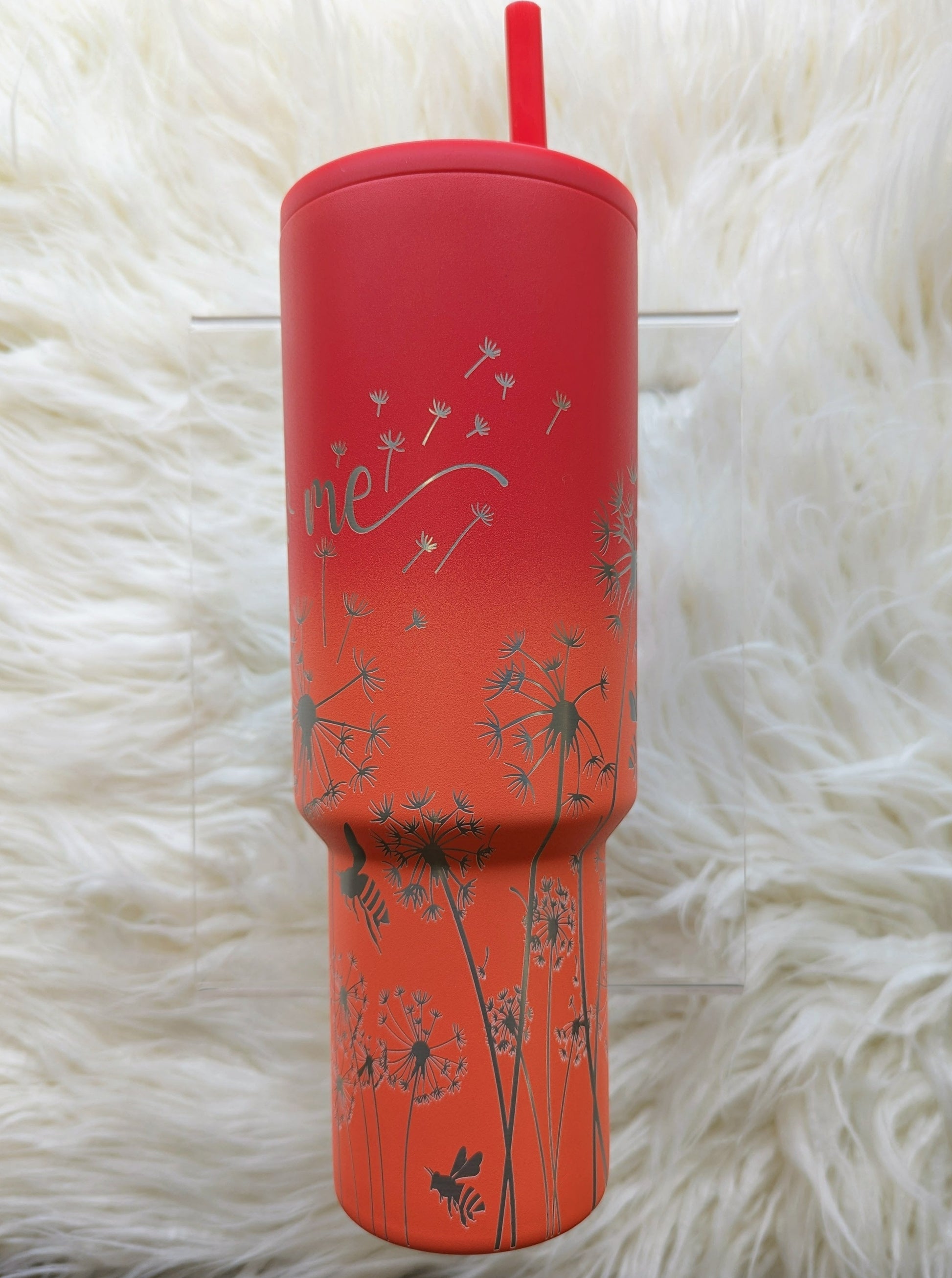 Dandelion "Blow Me" pattern engraved on peach and pink 40 oz insulated tumbler with handle by Simple Modern