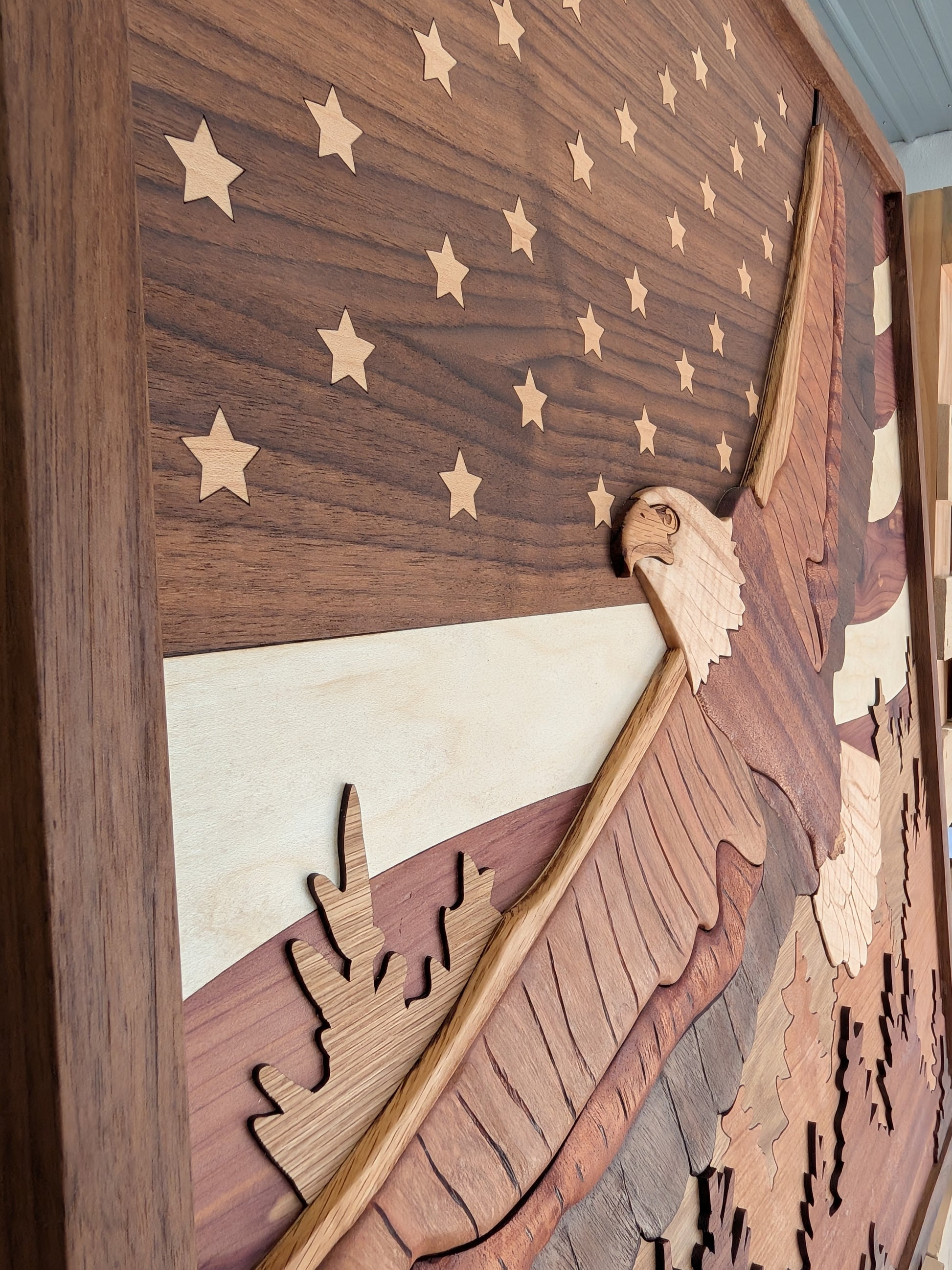Wooden wall art with an eagle and American flag design
