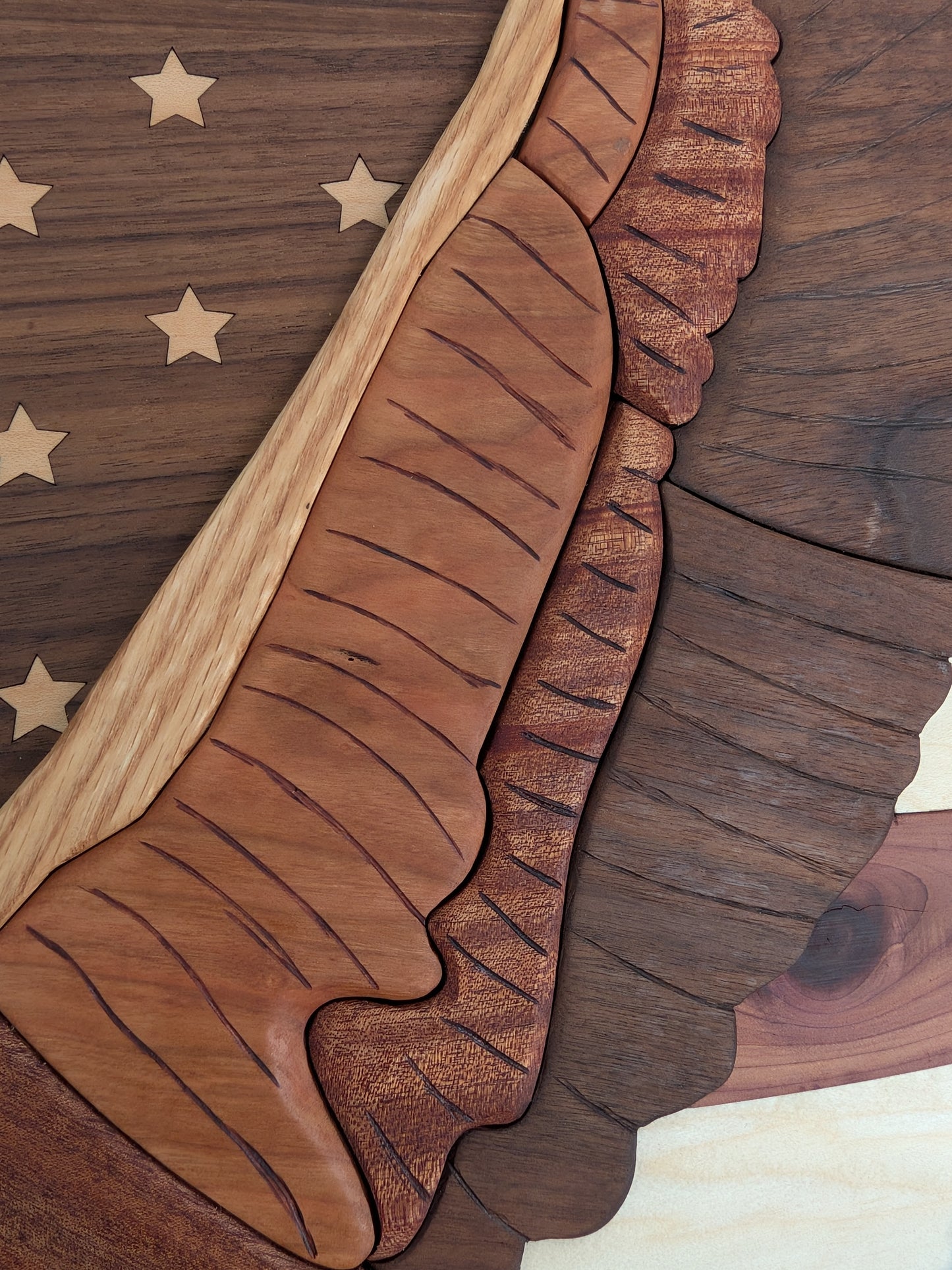 Wooden wall art with stars and stripes and eagle on a wooden background