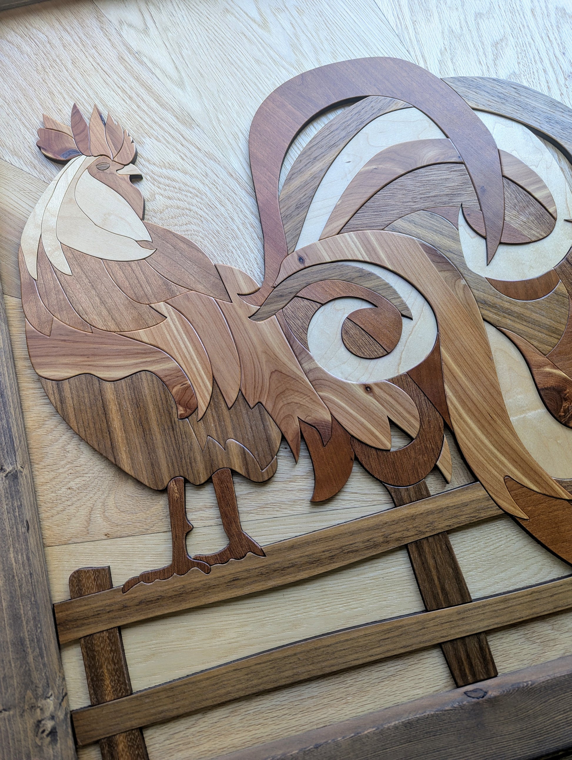 Angled view of wooden rooster wall art highlighting depth, texture, and layered veneer design.