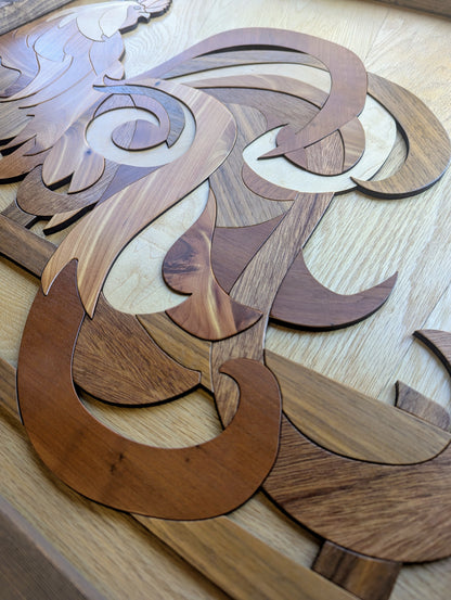 Close-up of rooster’s tail showcasing the swirling wood grain and variety of veneer species.