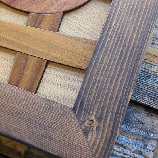 Video showing the corner of the rustic wood frame, emphasizing the texture, natural imperfections, and reclaimed wood grain.