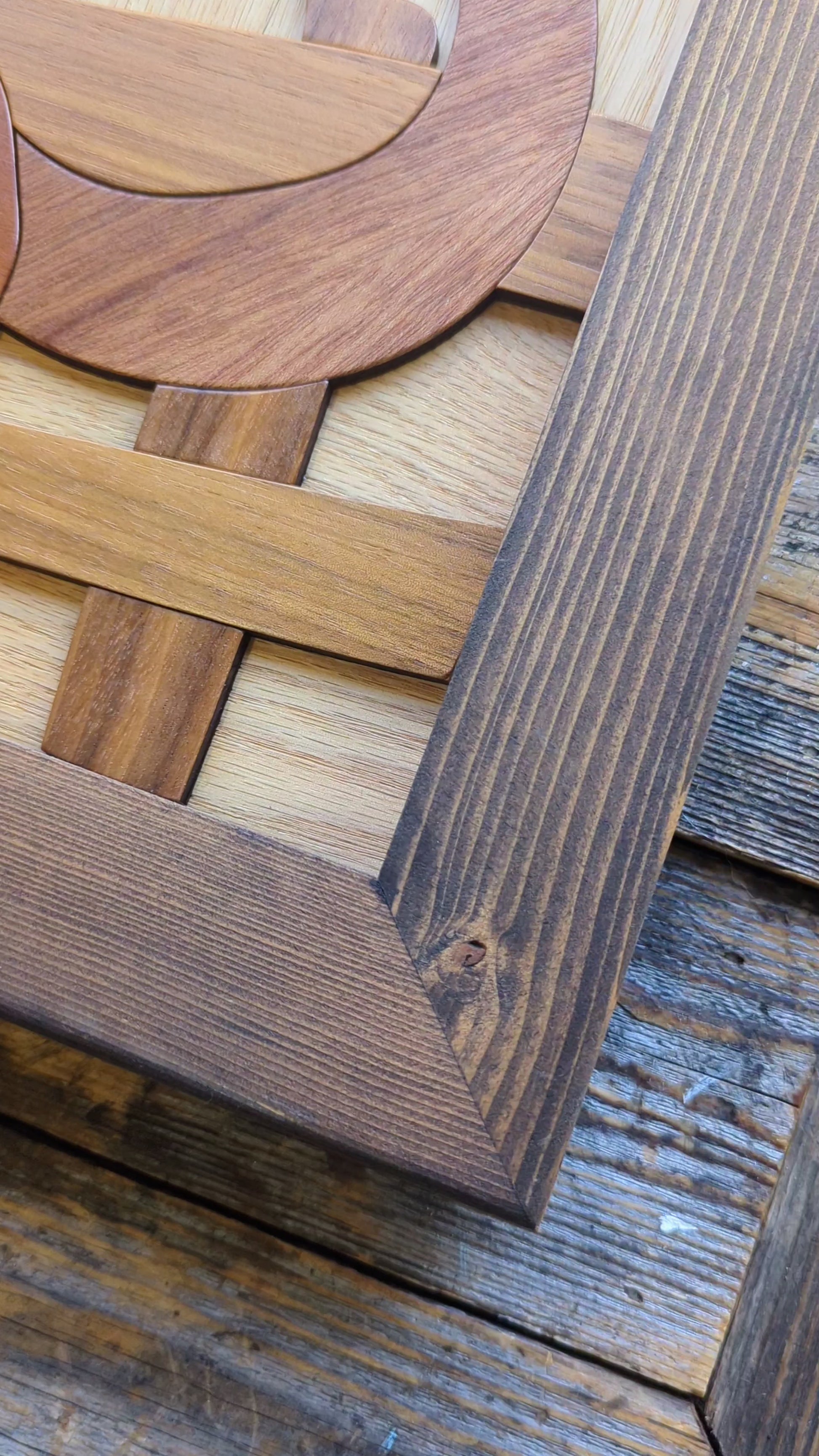 Video showing the corner of the rustic wood frame, emphasizing the texture, natural imperfections, and reclaimed wood grain.