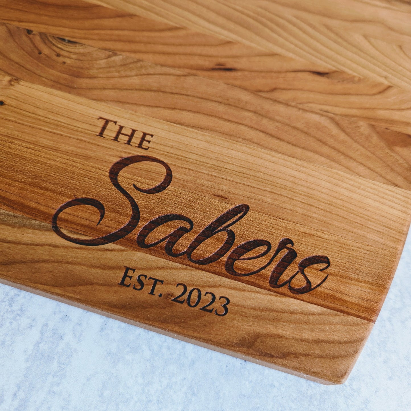 Personalized cutting board with last name